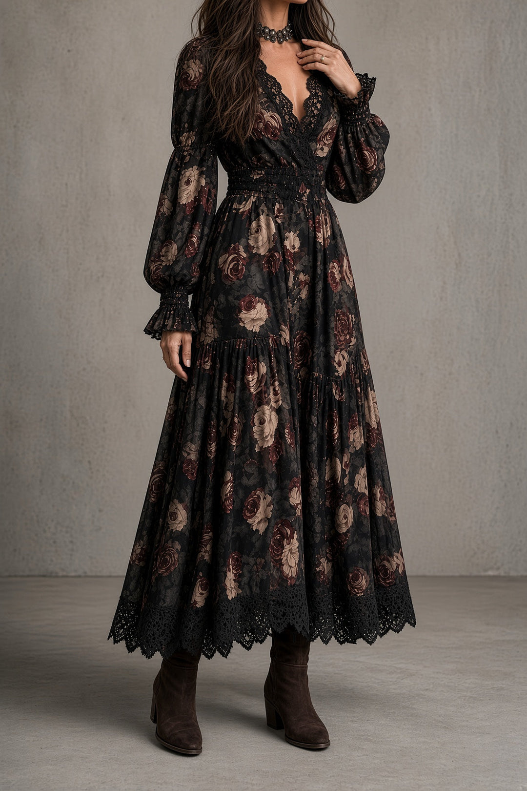Front view of v-neckline, long sleeves, banded waist and tiered skirt with lace hem