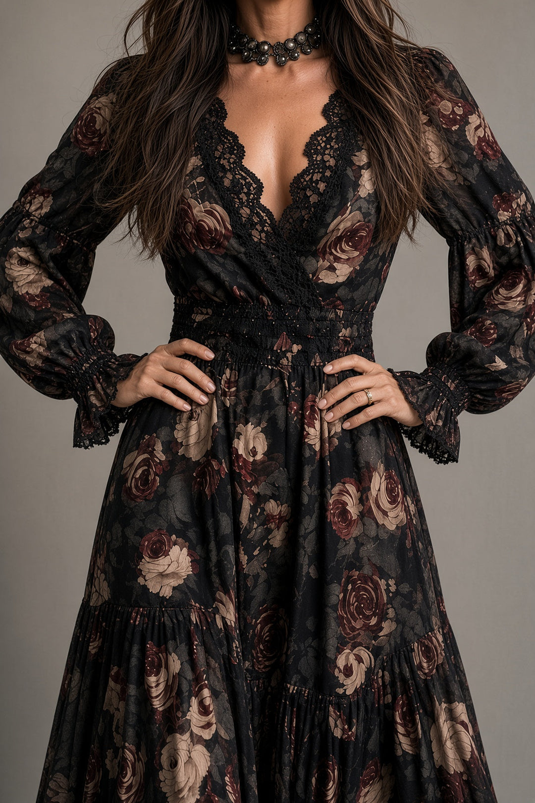 Detail view of v-neckline with lace edging, wrap bodice and shirred waist panel