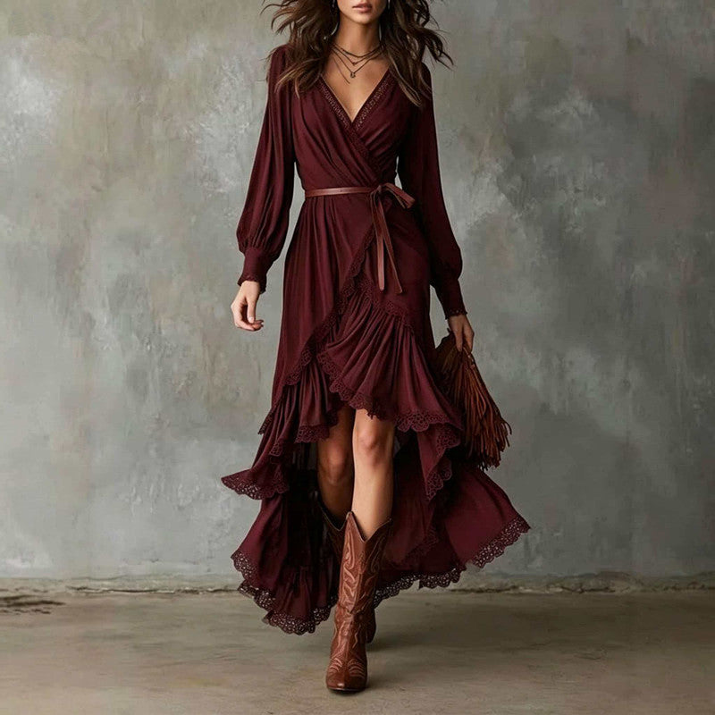 Front view close-up of v-neckline, long sleeves, waist tie and scalloped ruffle hem, burgundy