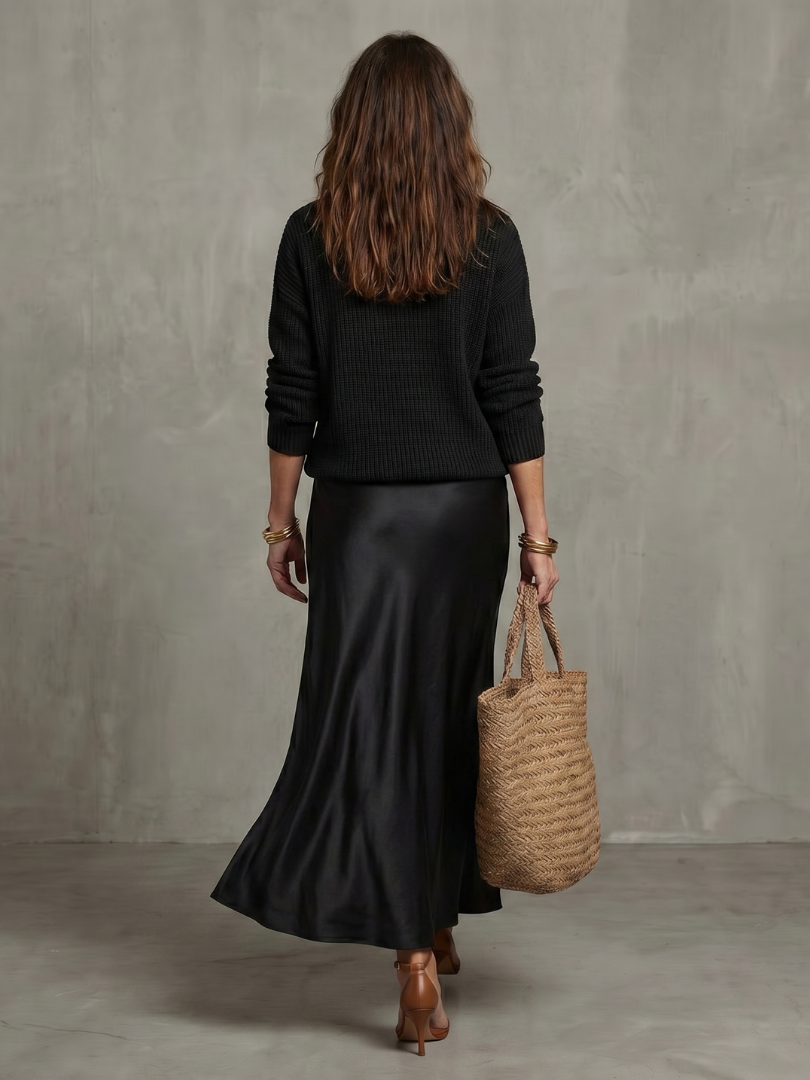Back view of sweater and skirt