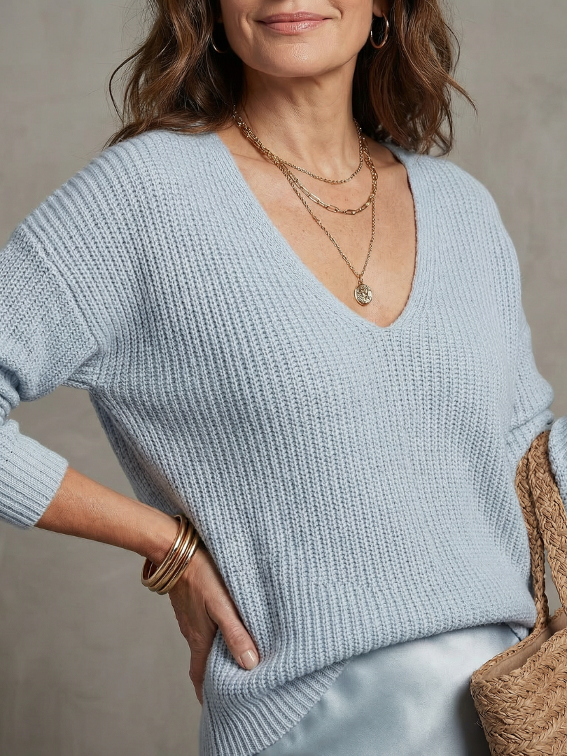 Detail of v-neckline and dropped shoulder seams