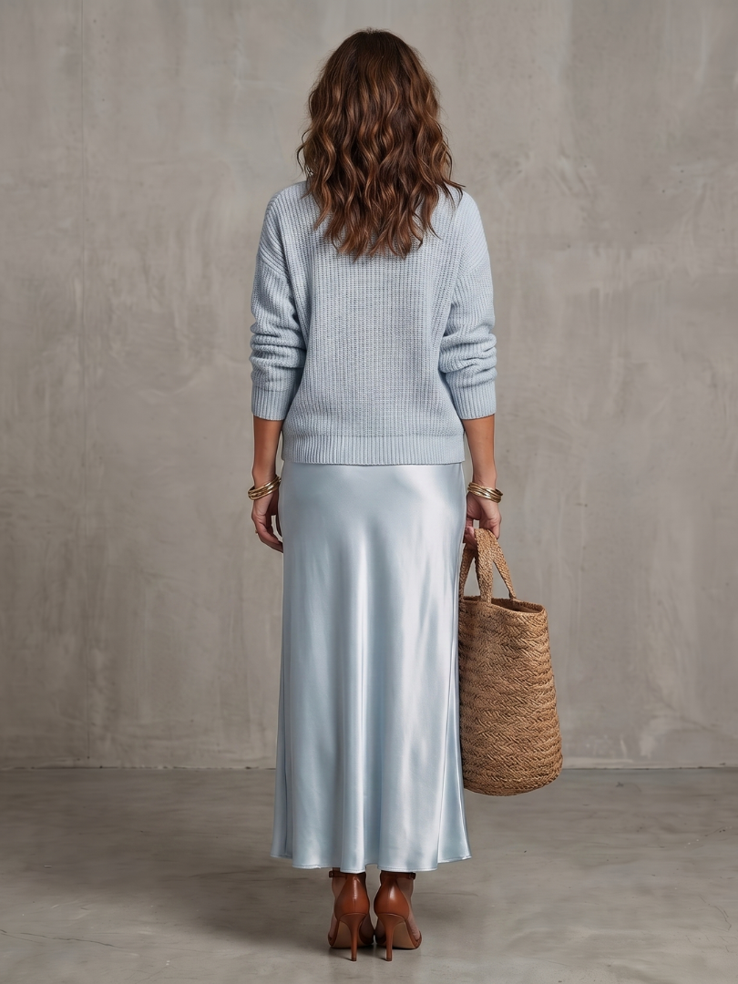 Back view of sweater and skirt