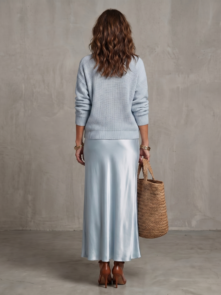 Back view of sweater and skirt