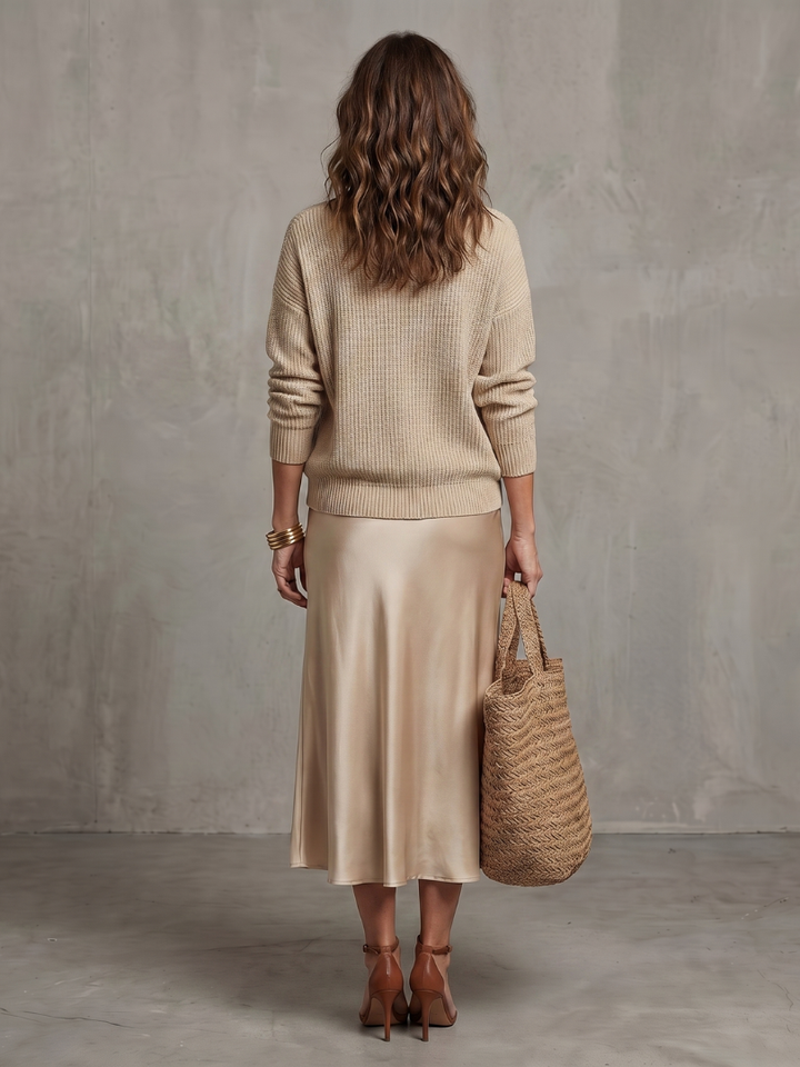 Back view of sweater and skirt