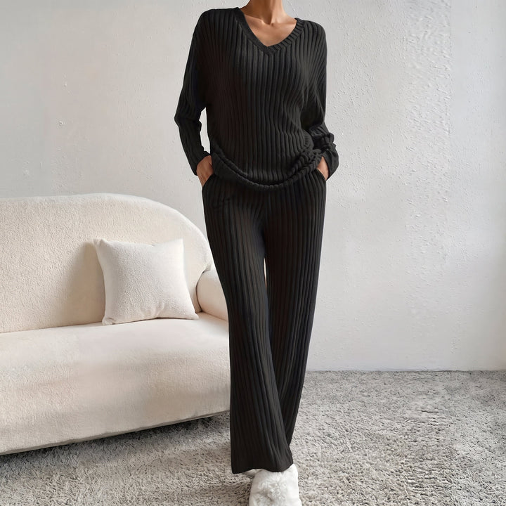 Front view of co-ord set showing v-neckline, long sleeves, side pockets and wide legs, black