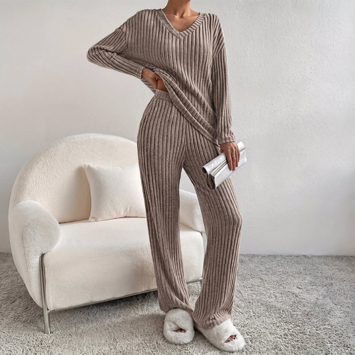 Front view showing v-neckline, long sleeves, banded waist and wide legs, brown