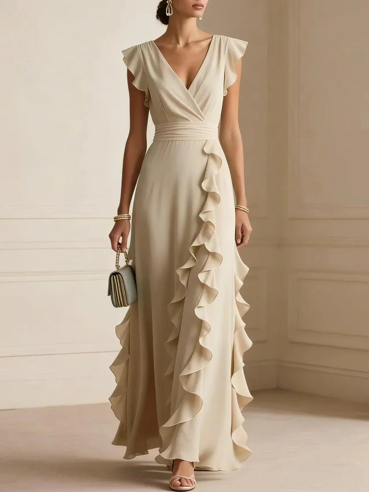 Front view of wrap front, banded waist and cascading ruffles, champagne