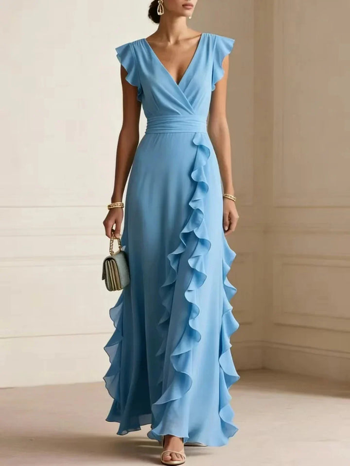 Front view showing V-neckline, wrap bodice and side ruffle trim, sky blue