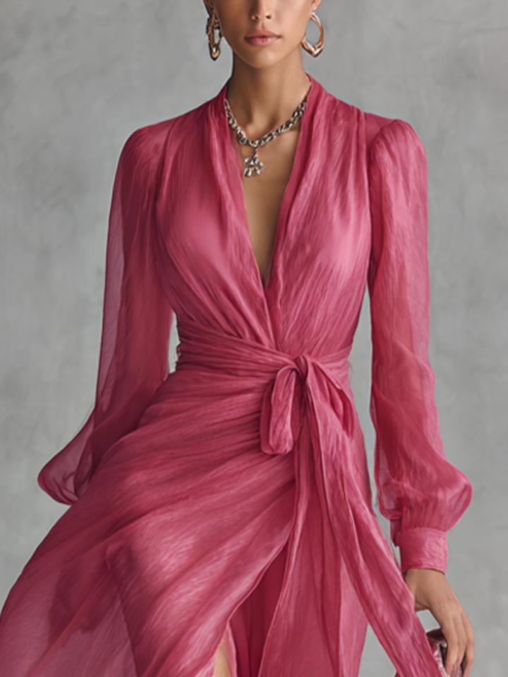Detail view of deep v-neckline, gathered bodice and waist tie