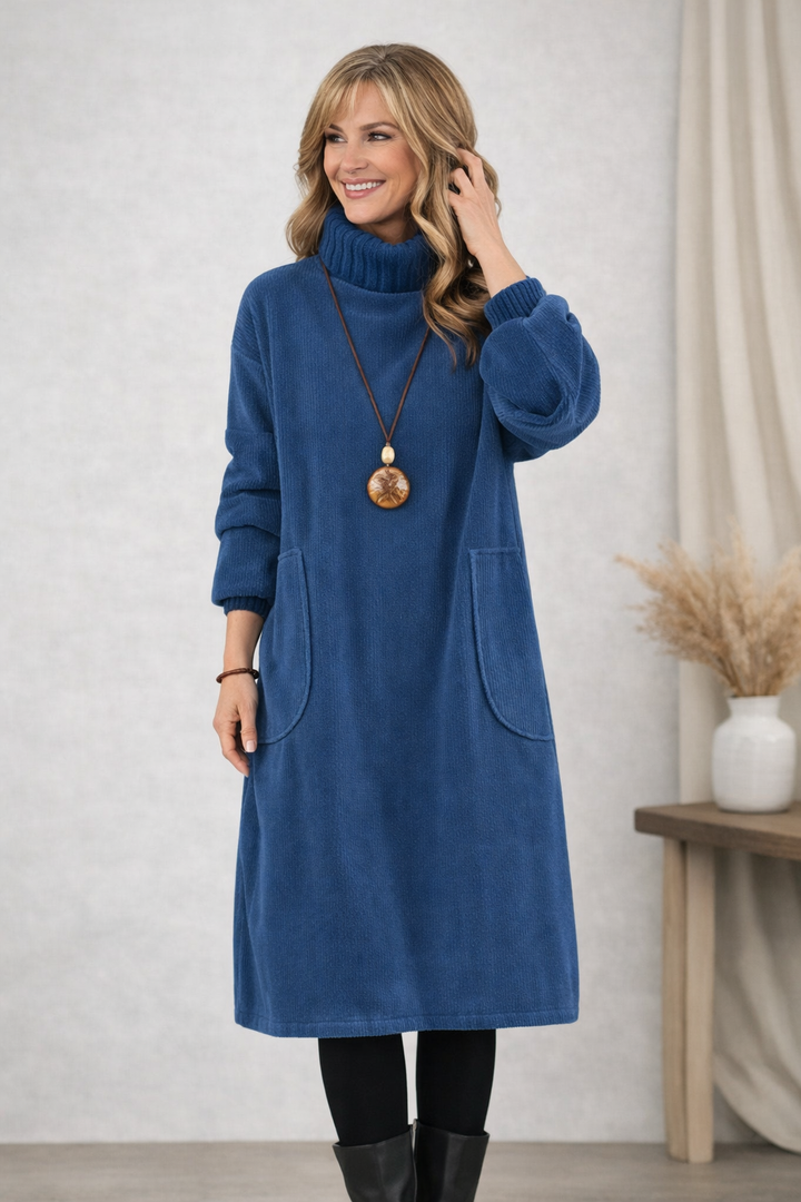 Front view of turtleneck midi dress with long sleeves and patch pockets, blue